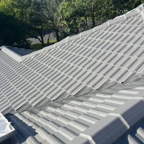 Light grey concrete tile roof restored with repointed ridge capping — Blue Mountains