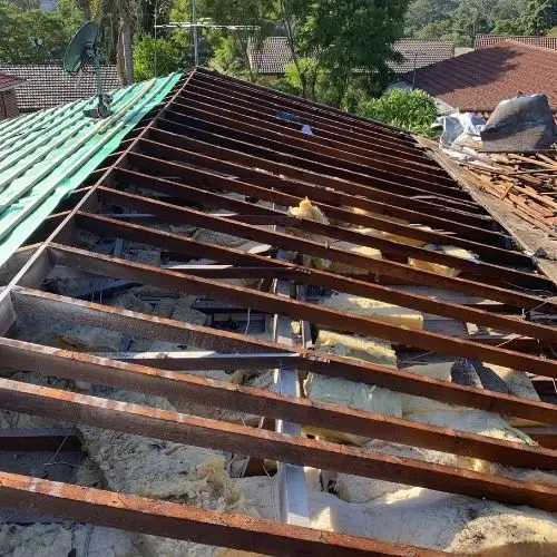 Roof stripped back to bare battens and rafters during full replacement — Blue Mountains roofing project